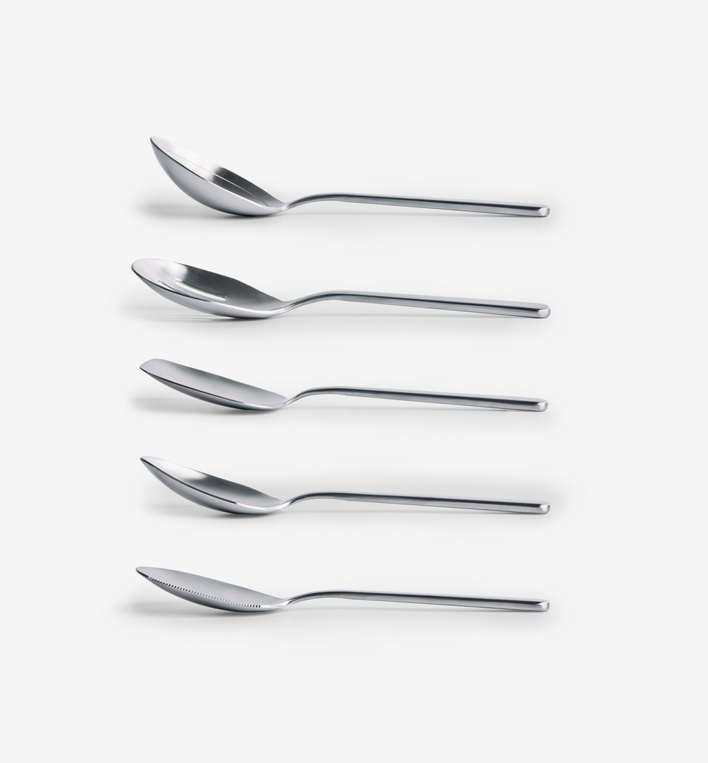 Stainless steel designer cutlery set with five spoons and knife in modern minimalist style